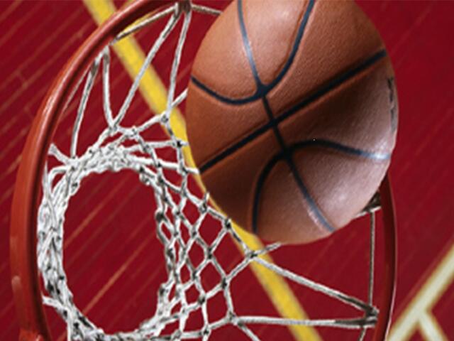 Basketball going into the basket from a sky view