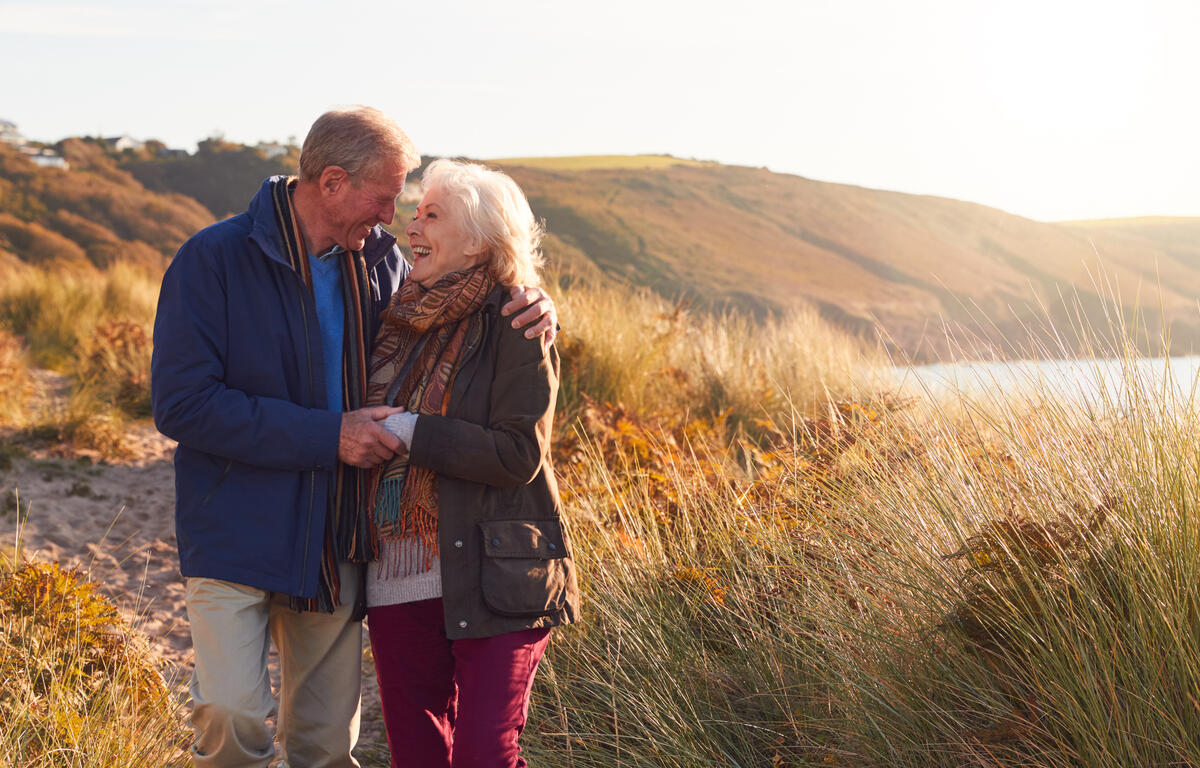 Senior Couple enjoys Walk Through Sand Dunes