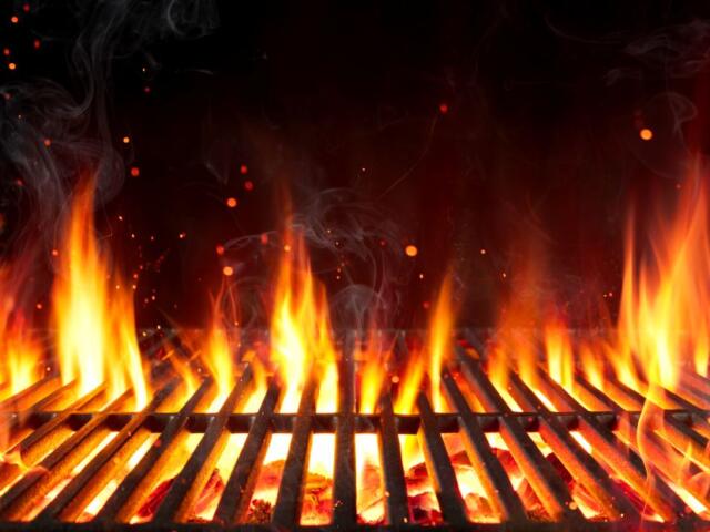 Grill with flames rising through