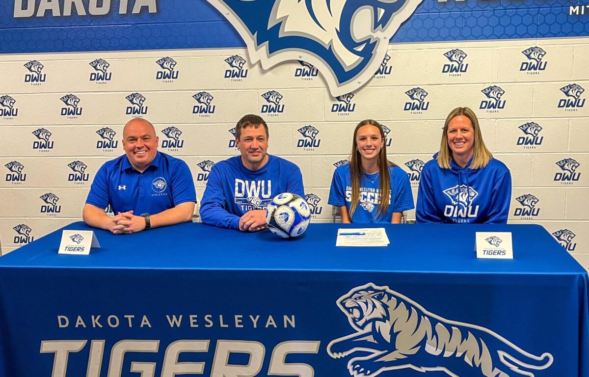 soccer players commits to DWU with parents and future coach