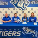 soccer players commits to DWU with parents and future coach