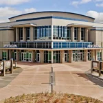Front of Sanford medical center with 'PENTAGON' entrance and blue-accented glass atrium in the center.