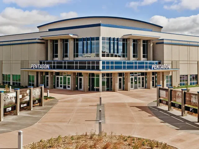 Front of Sanford medical center with 'PENTAGON' entrance and blue-accented glass atrium in the center.