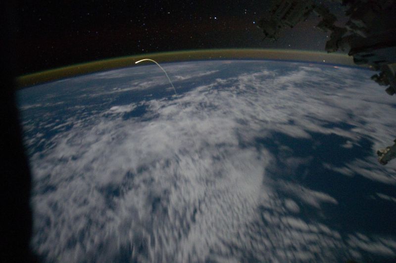 Image taken from the ISS of the Space Shuttle reentering the Earth's atmosphere.