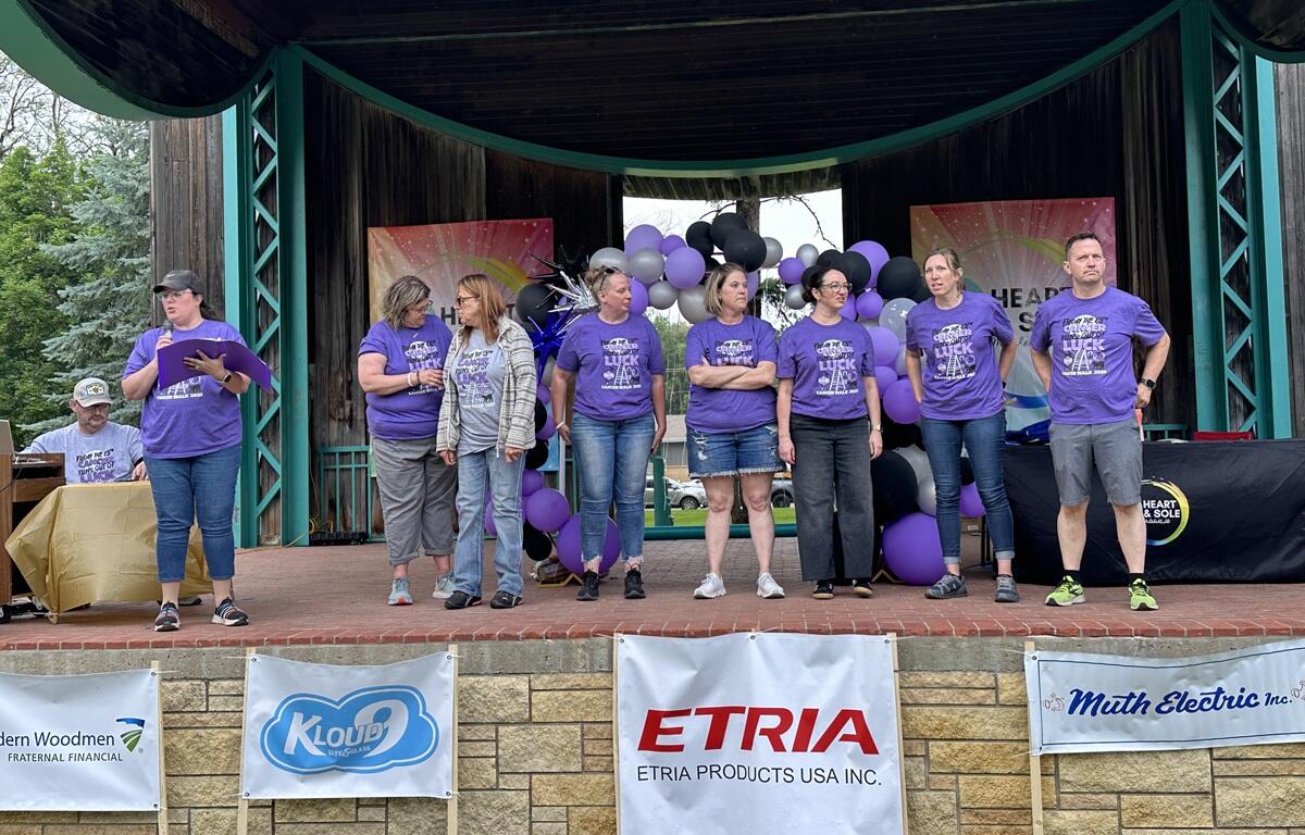 Heart and Sole Cancer Walk organizers on stage at the Hitchcock Park Bandshell.