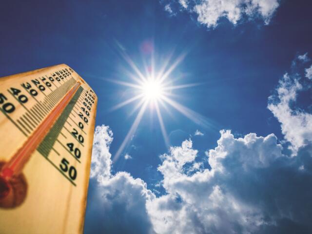 Sun beating down on a thermometer