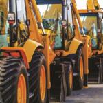 Rows of heavy equipment in a parking lot