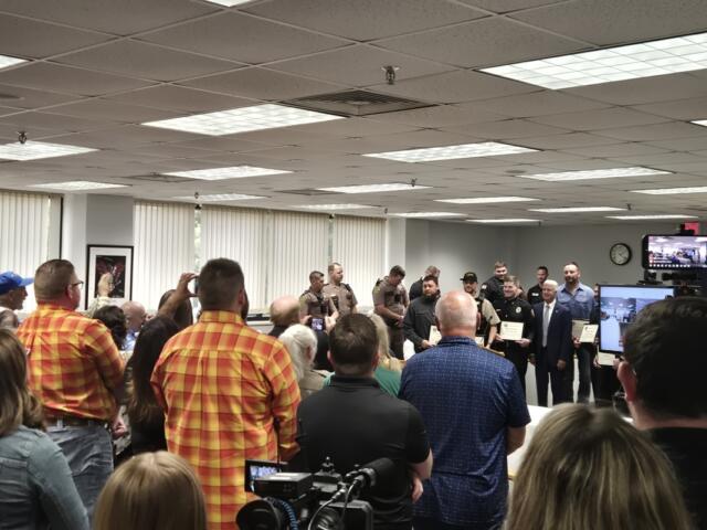 Crowd applauds after six awards were handed out for courage in saving two young children from a burning car in April