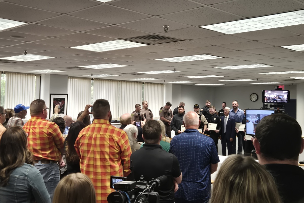 Crowd applauds after six awards were handed out for courage in saving two young children from a burning car in April