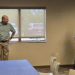 Ken Schlimgen, left, is presented with retirement gifts.