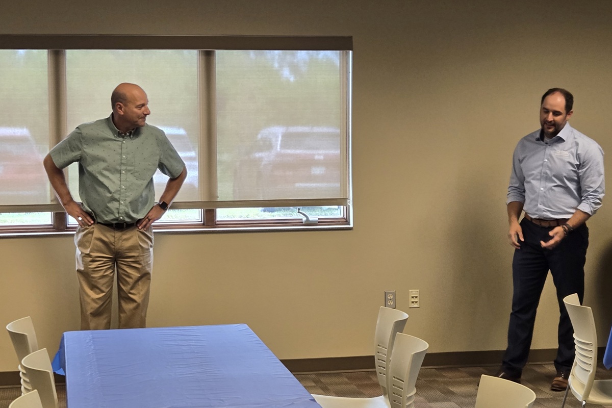 Ken Schlimgen, left, is presented with retirement gifts.