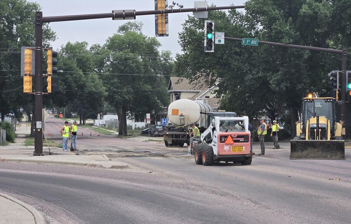 Crews working at East 1st Avenue and Burr on July 30, 2026