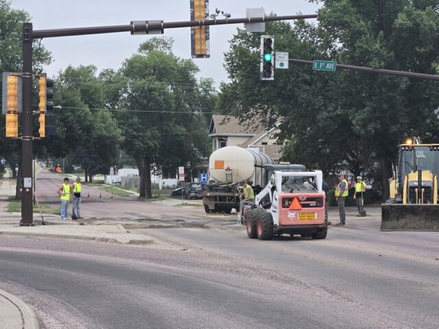 Crews working at East 1st Avenue and Burr on July 30, 2026