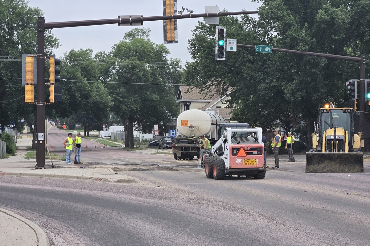 Crews working at East 1st Avenue and Burr on July 30, 2026
