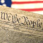Declaration of Independence with an American flag background.