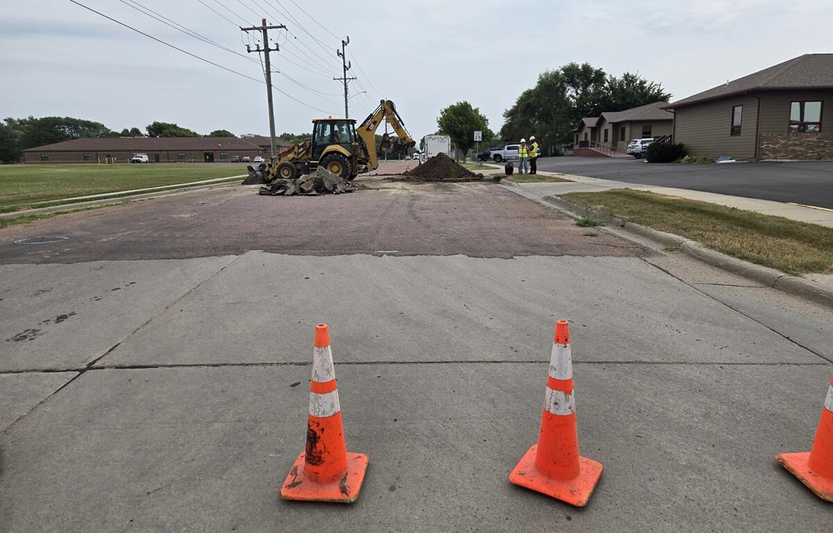 Crews excavating and replacing fire hydrant in Mitchell
