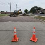 Crews excavating and replacing fire hydrant in Mitchell