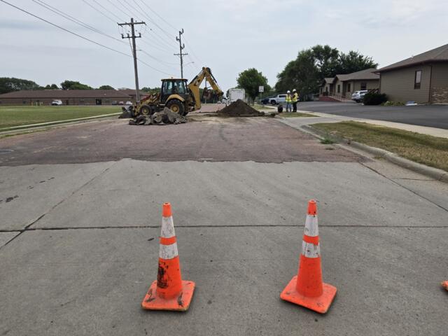 Crews excavating and replacing fire hydrant in Mitchell