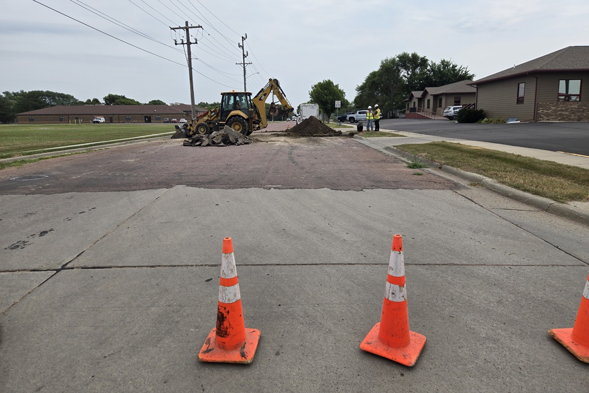Crews excavating and replacing fire hydrant in Mitchell