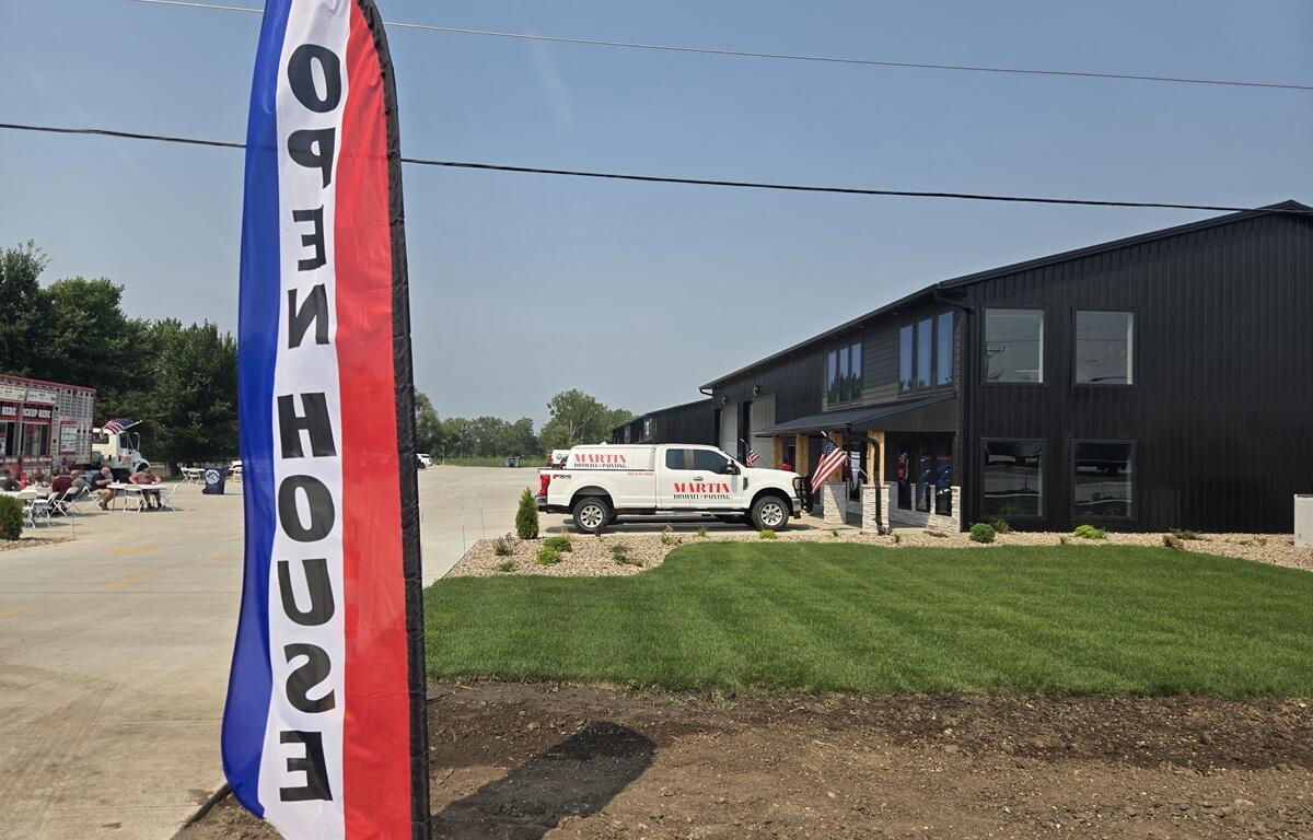 Open house roadside banners welcomes people to the new Mitchell Business Center on Monday, July 27