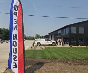 Open house roadside banners welcomes people to the new Mitchell Business Center on Monday, July 27