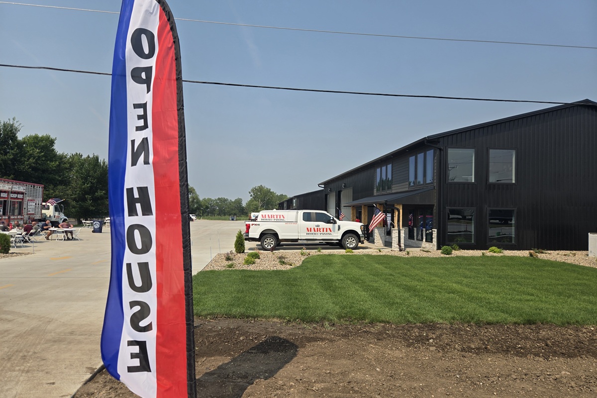 Open house roadside banners welcomes people to the new Mitchell Business Center on Monday, July 27