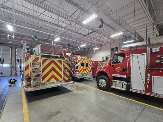 Fire trucks inside the bay at the Mitchell Public Safety Building, downtown.