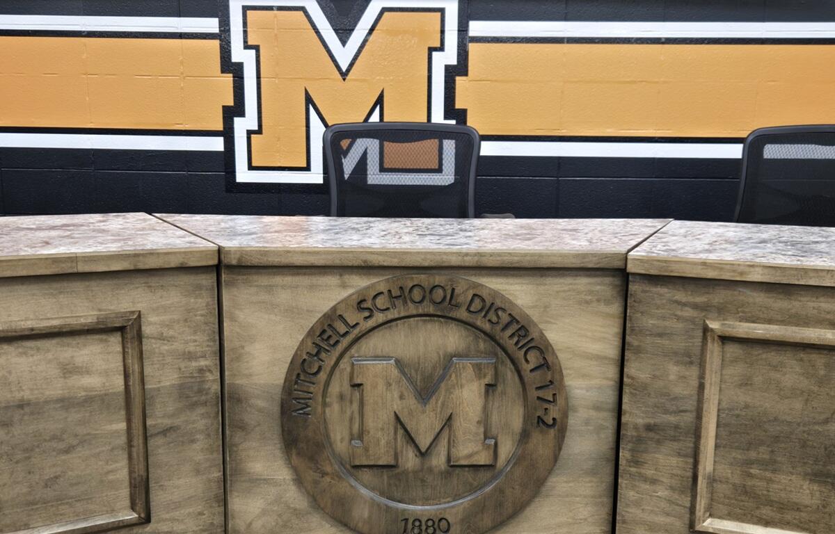 Mitchell School District crest inside School Board meeting room