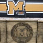 Mitchell School District crest inside School Board meeting room