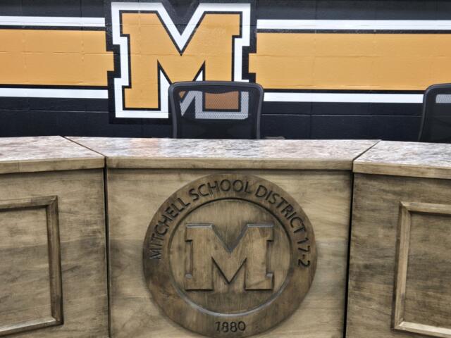Mitchell School District crest inside School Board meeting room