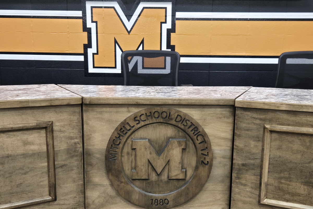 Mitchell School District crest inside School Board meeting room