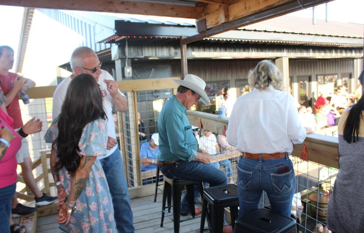 Gov. Rhoden sitting down to watch the Corn Palace Stampede Rodeo on Saturday, July 18, 2026.