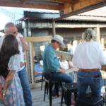 Gov. Rhoden sitting down to watch the Corn Palace Stampede Rodeo on Saturday, July 18, 2026.