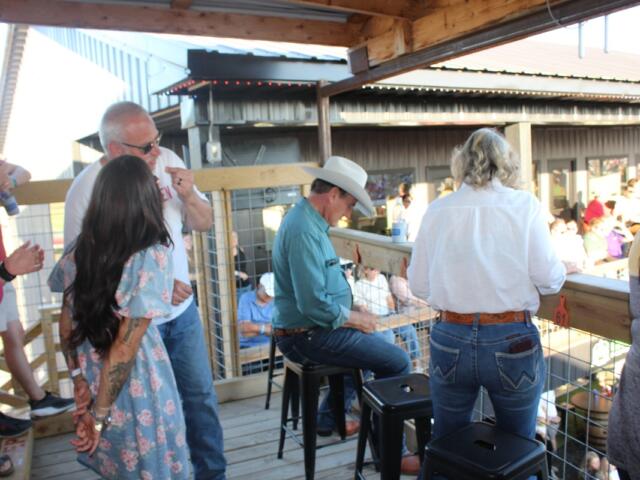 Gov. Rhoden sitting down to watch the Corn Palace Stampede Rodeo on Saturday, July 18, 2026.