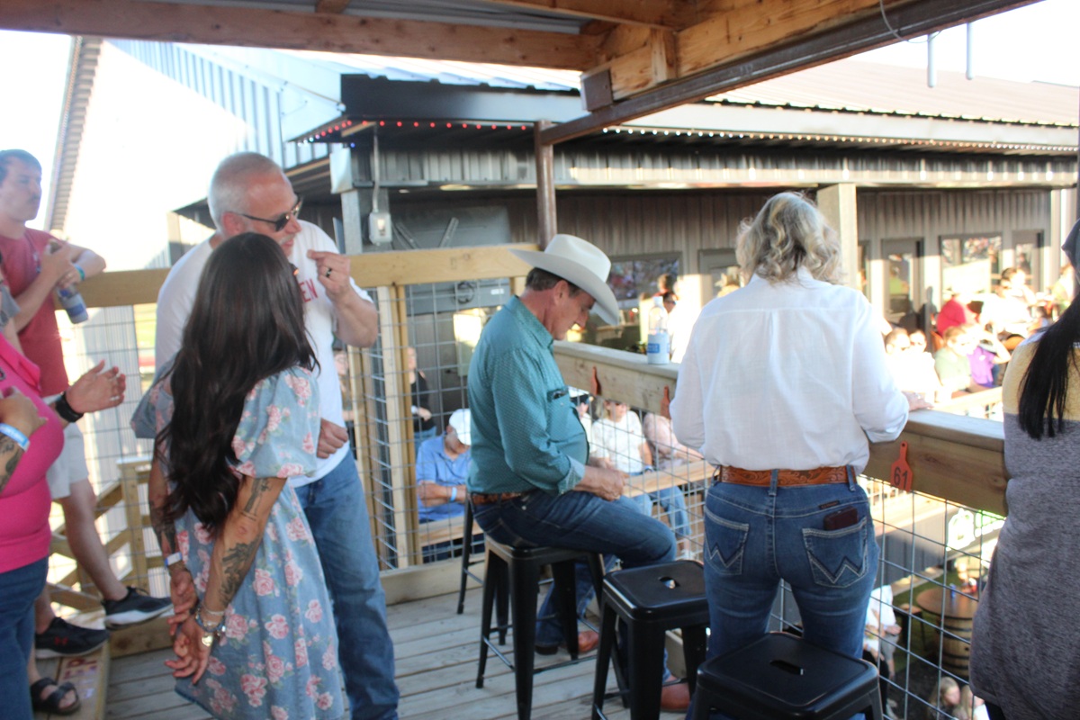 Gov. Rhoden sitting down to watch the Corn Palace Stampede Rodeo on Saturday, July 18, 2026.