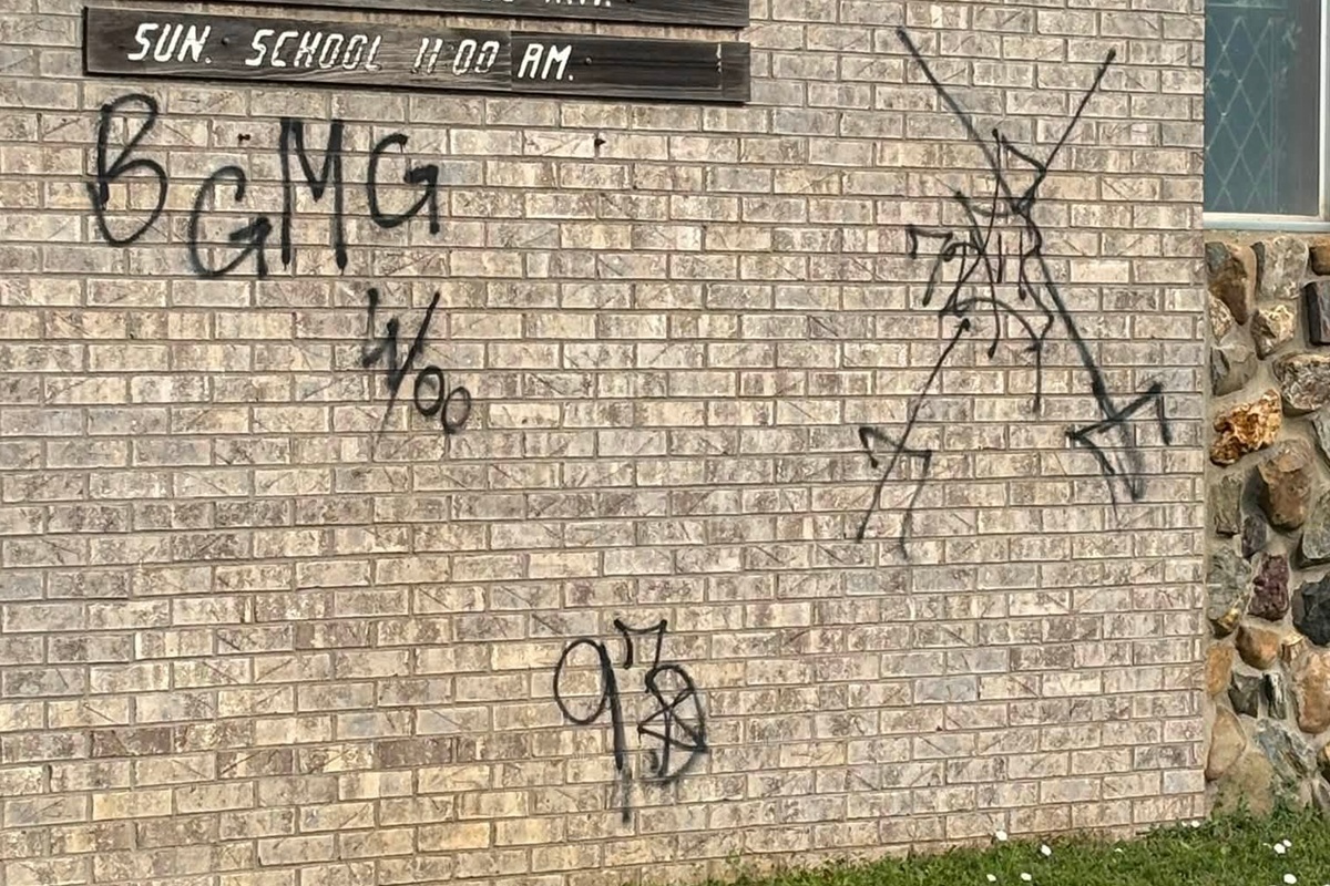 Graffiti on side of Woniya Wakan - Holy Spirit Episcopal Church in Wagner
