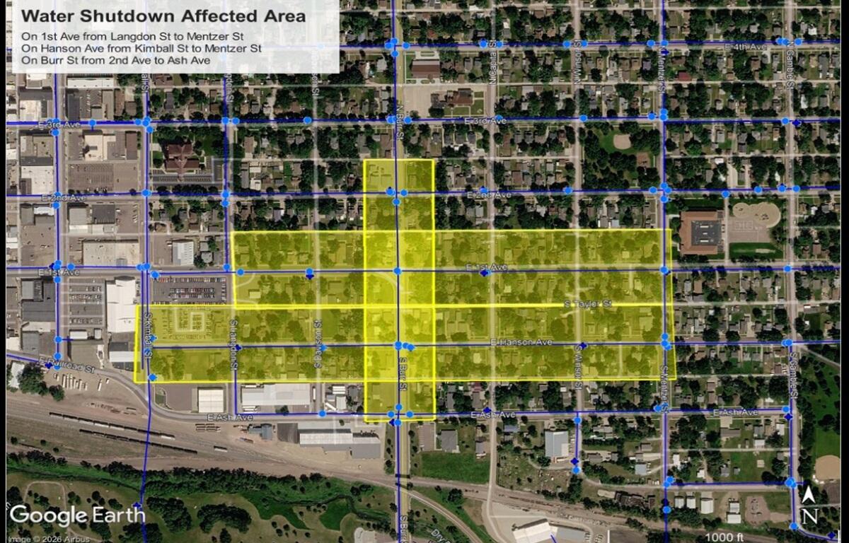 Aerial map with blue street grid and a yellow highlighted block area labeled 'Water Shutdown Affected Area,' showing the water shutoff zone over streets and avenues.