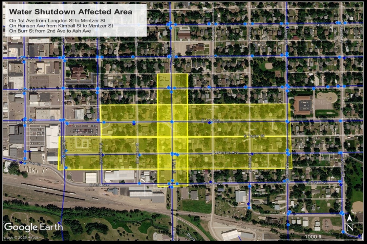 Aerial map with blue street grid and a yellow highlighted block area labeled 'Water Shutdown Affected Area,' showing the water shutoff zone over streets and avenues.